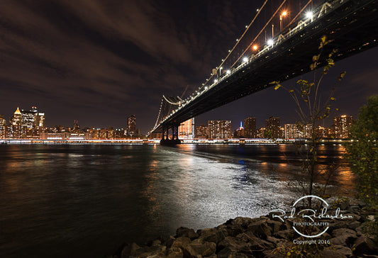 Iconic Nighttime View – Under the Bridge Facing Manhattan